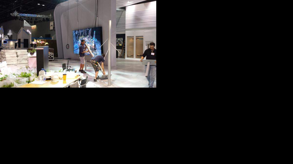 
A crew works to assemble the exhibit for Bombardier at the National Business Aviation Association convention in Orlando, Fla., on Monday. The exhibits will open to the public on Tuesday.
