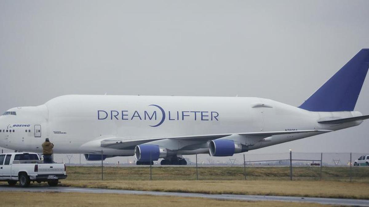 
An onlooker takes a photo of the Boeing 747 LCF Dreamlifter from the back of his truck. The plane mistakenly landed at Jabara Airport in Wichita in 2013. Pilots thought they were landing at McConnell Air Force Base. (Nov. 21, 2013)
