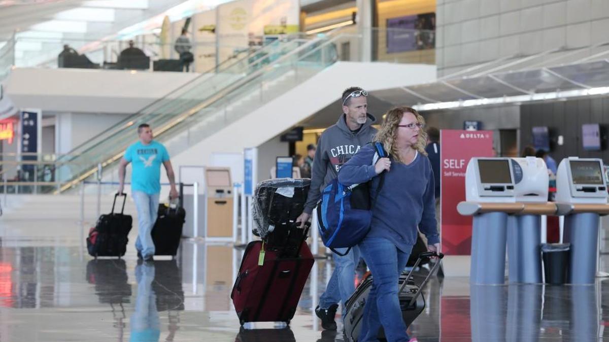 Travelers walk near the check-in area at Wichita Eisenhower National Airport in November.