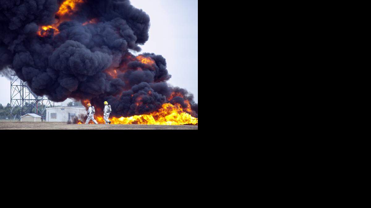 
The Wichita Airport Authority conducted a large-scale disaster exercise Tuesday morning, simulating a 737 aircraft that crashed near a runway and broke apart on impact. Students from Bishop Carroll and Derby High School played the victims during the training exercise for area fire, EMS and emergency workers. (Sept. 16, 2014) 
