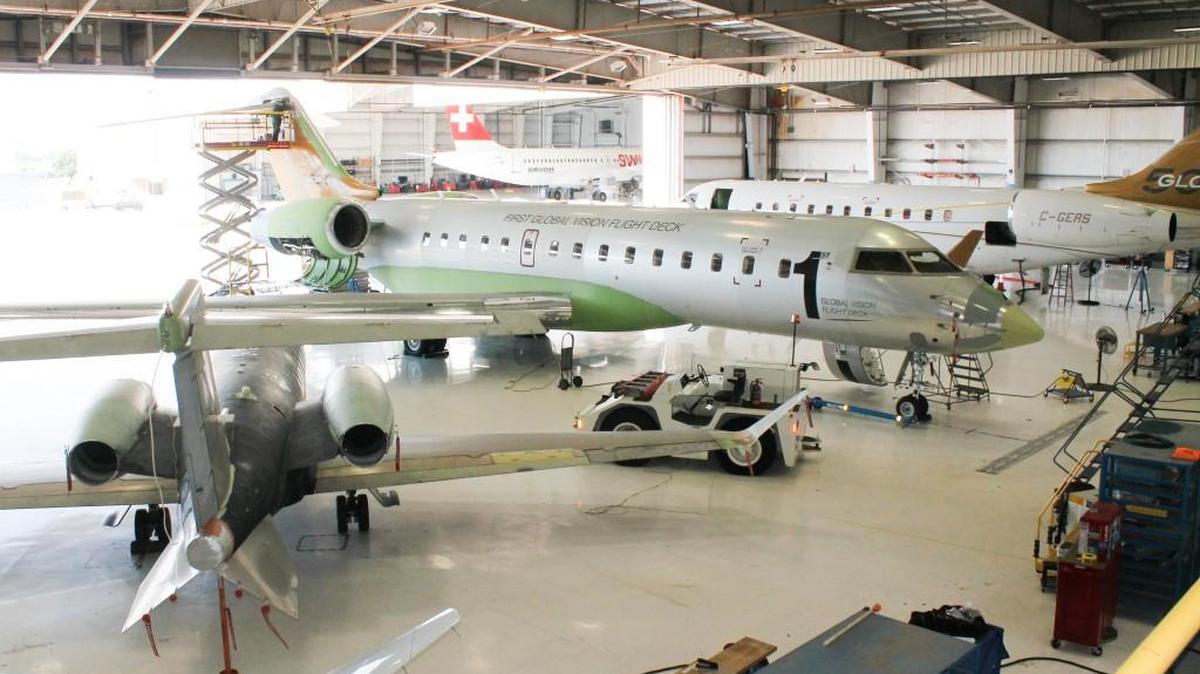 Several Bombardier and Learjet business and commercial jets used for flight tests sit inside hangars at the Bombardier Flight Test Center in Wichita.