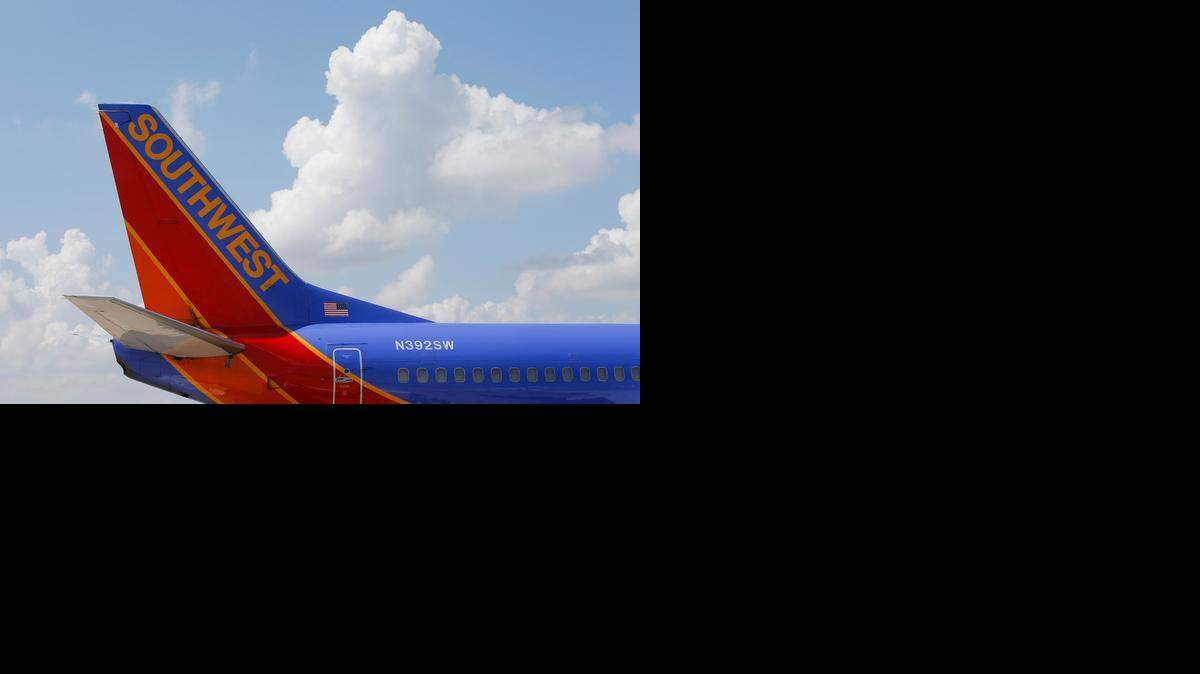 
A Southwest Airlines 737 sits at the gate at Wichita’s Mid-Continent Airport in July 2013. Since Southwest’s entry in the Wichita market, some fares have dropped, but other fares and passenger traffic have increased.
