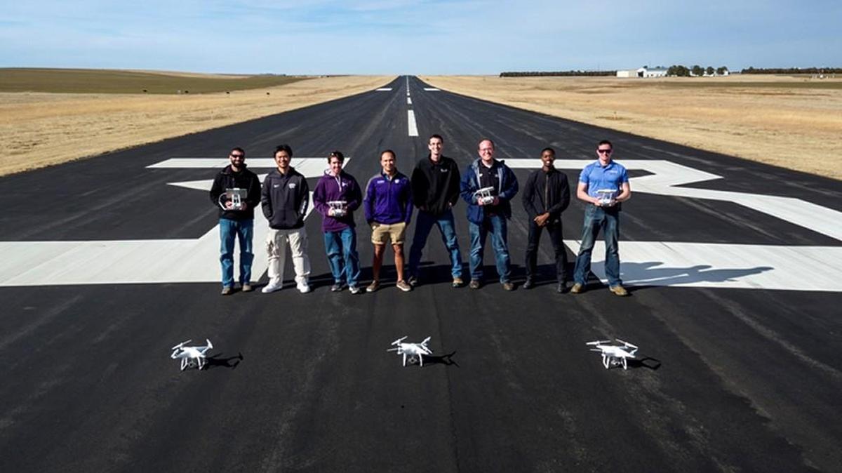 Airport management and unmanned aircraft systems students at the Kansas State University Polytechnic Campus performed a proof of concept at the Kit Carson County Airport in Colorado as part of their winning research proposal. From left are: Daniel Melia, Kit Carson County Airport manager; Hsin Huang, senior in airport management; Preston Renfro, May 2017 bachelor’s graduate in unmanned aircraft systems; Ian Bonsall, May 2017 bachelor’s graduate in airport management; Trevor Witt, data analyst in the Applied Aviation Research Center; David Burchfield, UAS teaching assistant professor and degree option coordinator; Chris Senn, UAS teaching assistant professor; and Elliot Rogers, May 2017 bachelor’s graduate in airport management.