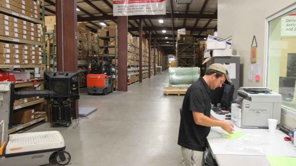 Thomas McDowell fulfills a parts order from GlobalParts Group’s 90,000-square-foot warehouse and administrative offices at the Augusta Industrial Park.