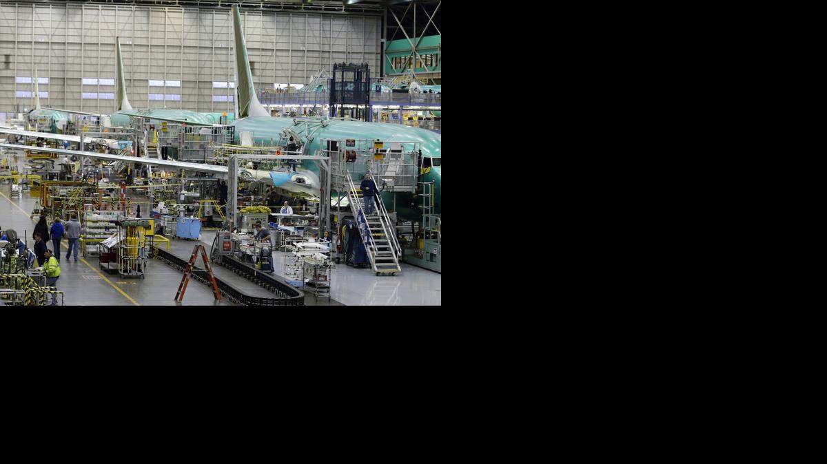 
Workers assemble Boeing Co. Next-Generation 737 airplanes in January 2013. Since then, Boeing has ramped up production rates for the 737 from 38 a month to 42. And the company said Thursday that rates will be boosted to 52 a month by 2018.
