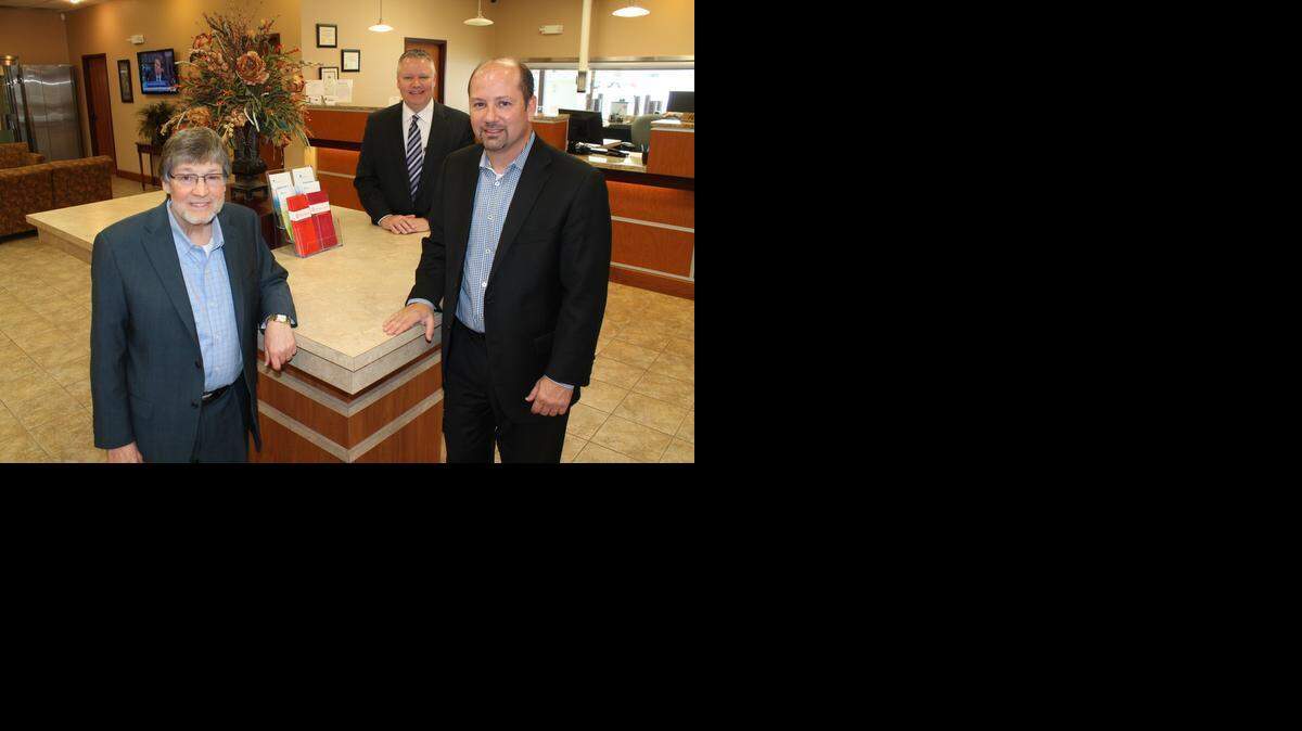 
From left, Union State Bank chairman Bill Docking, RelianzBank CEO David Harris and Union State CEO Eric Kurtz stand inside Wichita-based RelianzBank. Relianz will be acquired by Arkansas City-based Union State in a deal expected to close later this year.
