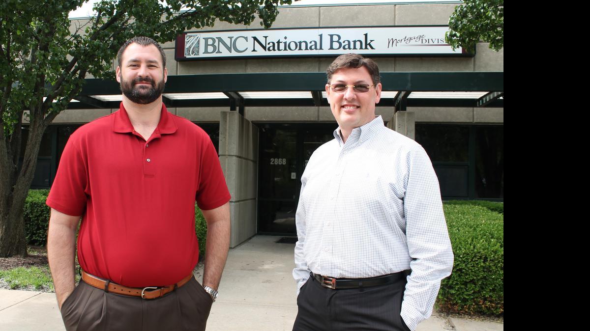 
From left, BNC National Bank Mortgage division vice president J.R. Rohr and area manager Matt Wendling, outside the company’s office at 2868 N. Ridge.
