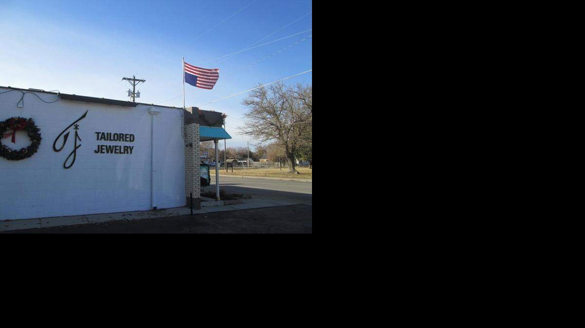
Ted Sanders would prefer to fly the American flag correctly outside his shop, but he wants to show that he’s in distress.
