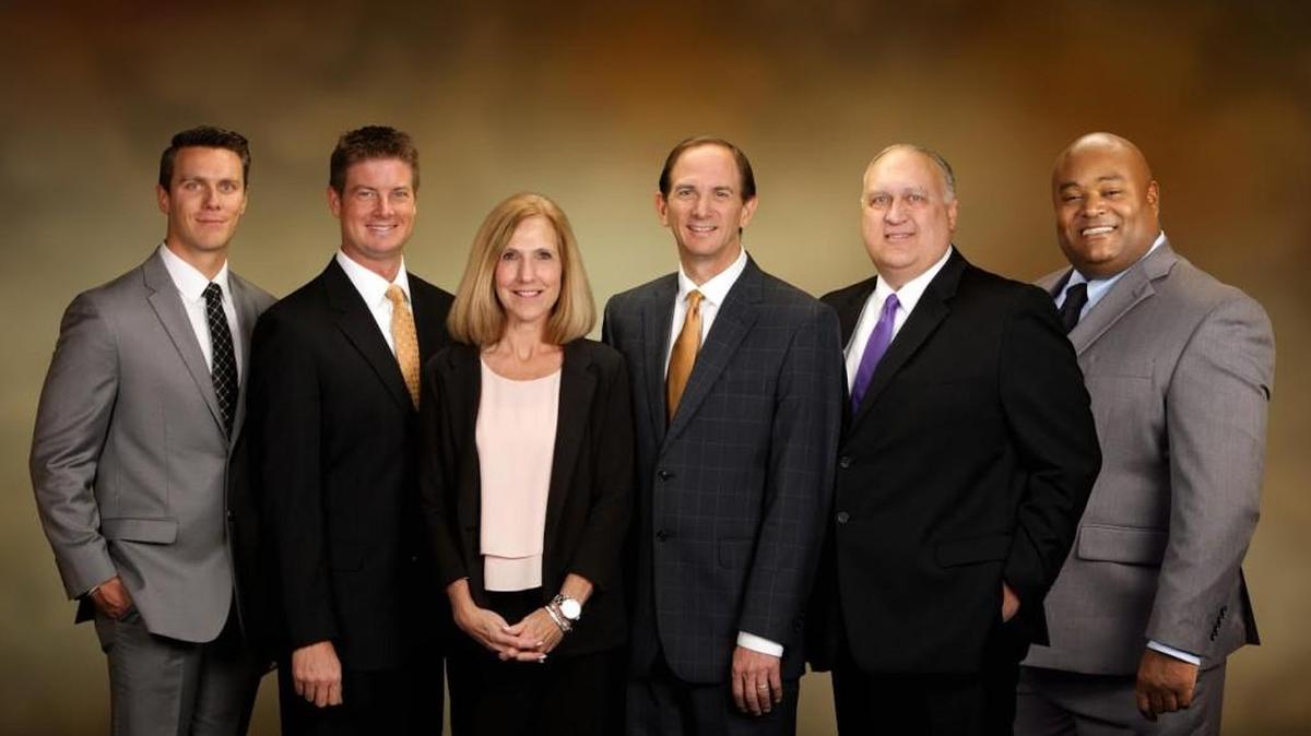 Market Advisory Group, which is moving to a new downtown office, includes, from left, Jonathon McCoy, Matt Goolsby, Stephanie Perkins, Danny Goolsby, Larry Kloefkorn and Chris Sawyer.