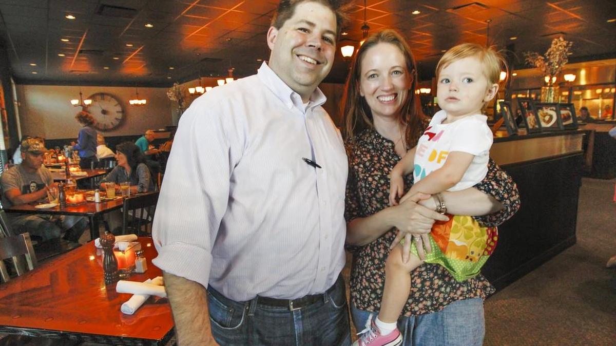 Twelve Restaurant owner Bryce Kuhn, with his wife, Toi and daughter Alyson, 2, has done some work on his restaurant. (July 24, 2015)