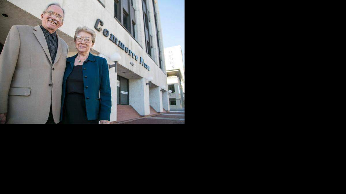 
Les and Courtney Ruthven in front of their Commerce Plaza building, which will be auctioned on March 3.
