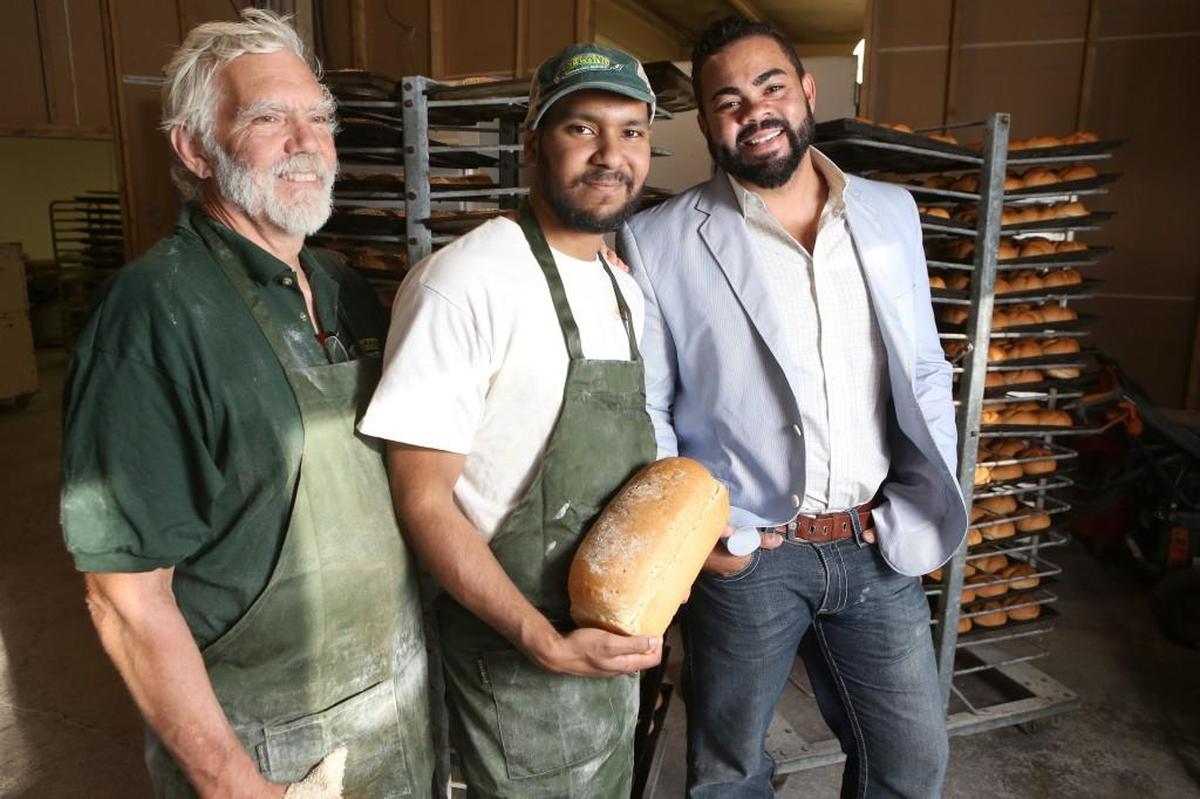 Brant Dumford, far right, is opening a co-op bakery called The Coop in Derby. He’s pictured here with his father, Kelly, far left, who founded Delano Bakery, and his brother, Cy, center.