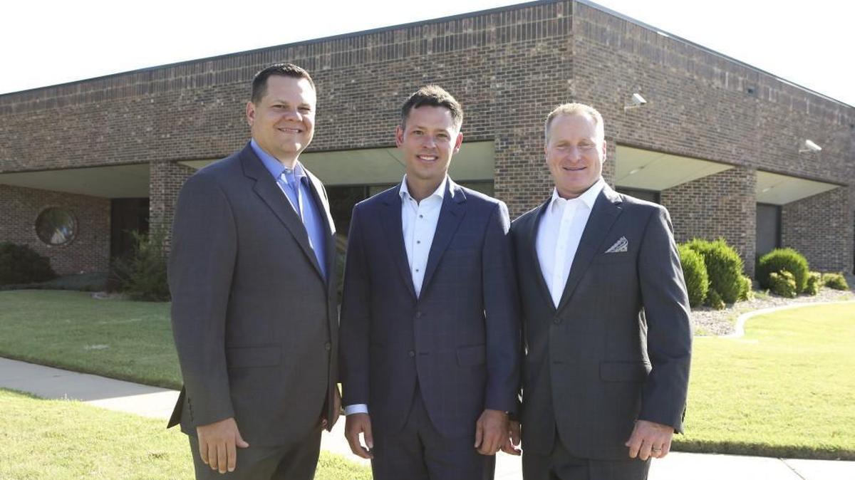 DeVaughn James Injury Lawyers partners Richard James, left, Cody Claassen, center, and Dustin DeVaughn stand in front of their new west-side office at 7940 W. Kellogg, which they plan to open in October.