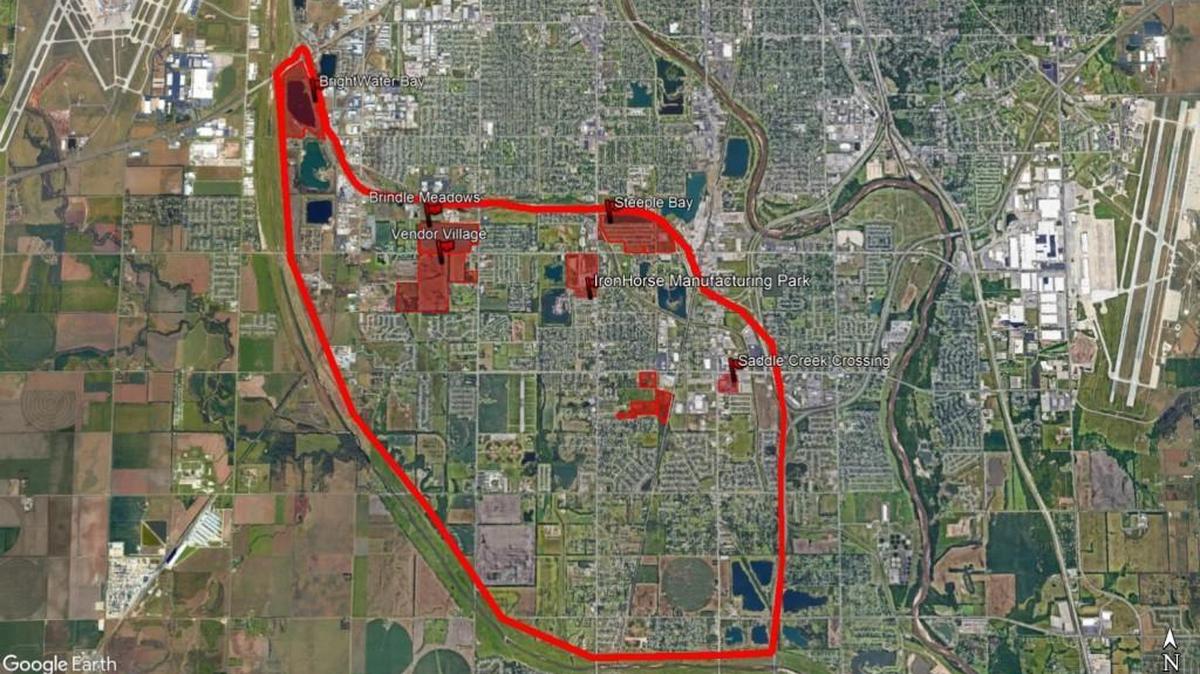 The large area in red is the new CrossGate District, which is bordered by I-235 on the north, I-35 on the east and the Big Ditch on the west and south. The other areas in red are properties that Jeff Lange and his team are developing, including Steeple Bay at the northeast part of the district where Camping World and Gander Outdoors will locate.