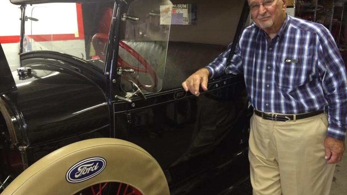 Jim Newhouse and his vintage cars will remain at M&M Insurance, which he decided he wasn’t ready to sell.