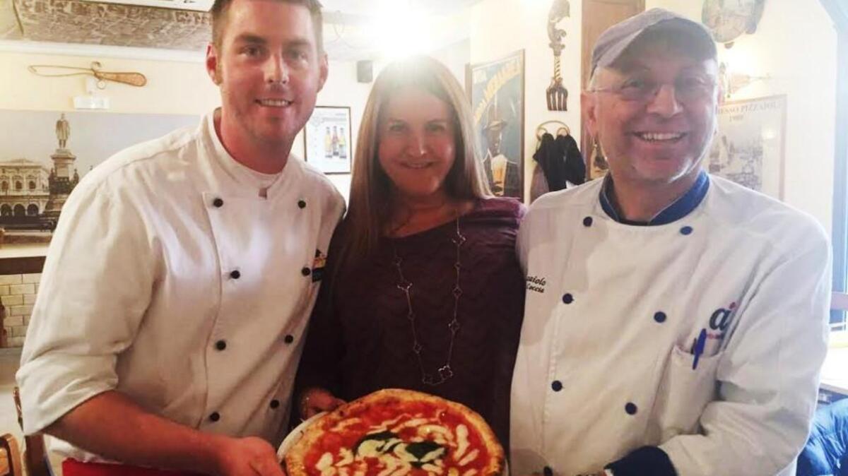 Robert McMullin (left), his wife Carolina Tabares and Enzo Coccia, the pizzaiolo that Robert McMullin trained with in Italy in preparation for opening Piatto Neapolitan Pizzeria in Wichita.