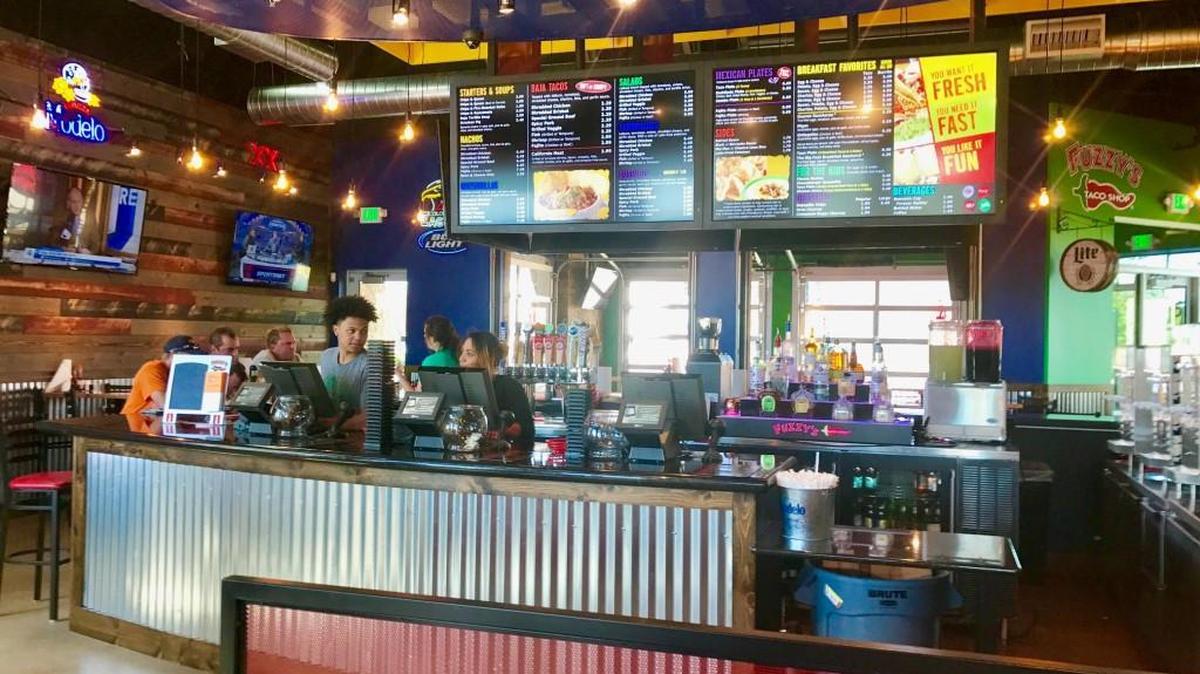 A bar is a central focus at Fuzzy’s Taco Shop, which serves Baja-style Mexican food and a variety of tequila and margarita drinks. The first Wichita Fuzzy’s will open this fall at 306 N. Rock Road.