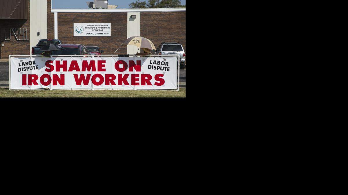 
Representatives of the Carpenters union protest the Ironworkers union at a building at First and Cleveland, which the Ironworkers share with five other unions.
