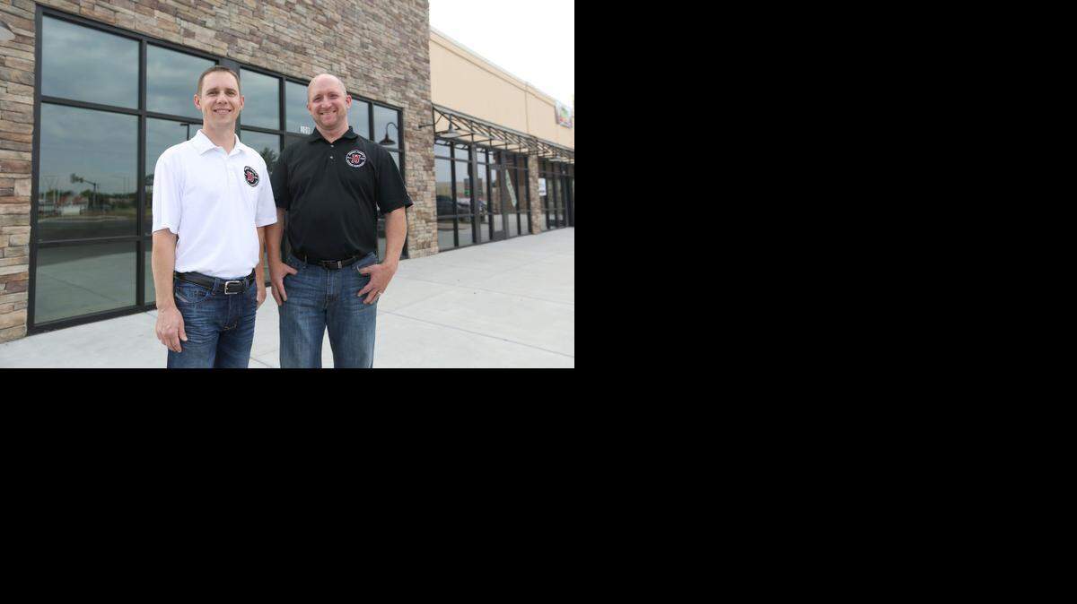 
Jimmy John's Gourmet Sandwiches franchisee Matt Brane, left, and area manager Clay McDowell stand in front of the space where they will open a restaurant near Maple and Ridge. They will be in the same strip center as the new west-side Twin Peaks and Wingstop, a new franchise for Wichita.
