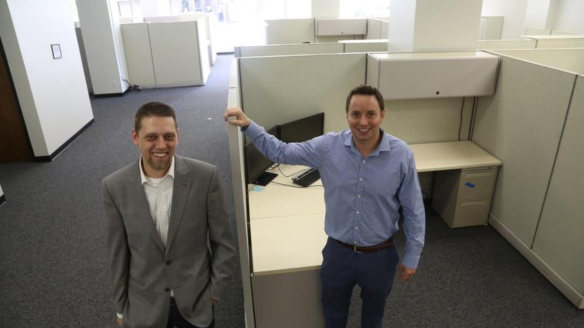Mike Ricklefs, right, and Greg Bolain are partners in King of Freight, a freight brokerage, and are expanding with more office space and employees.