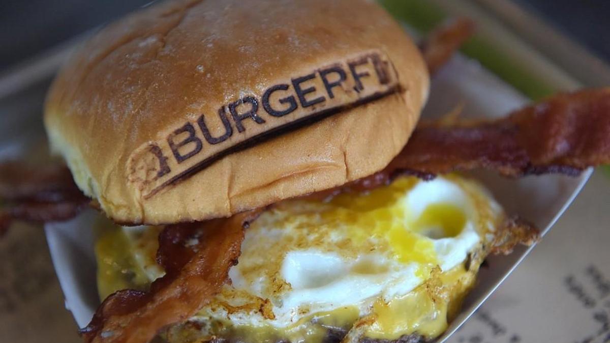 BurgerFi, which will open next month in NewMarket Square, stamps all its burger buns with its logo.