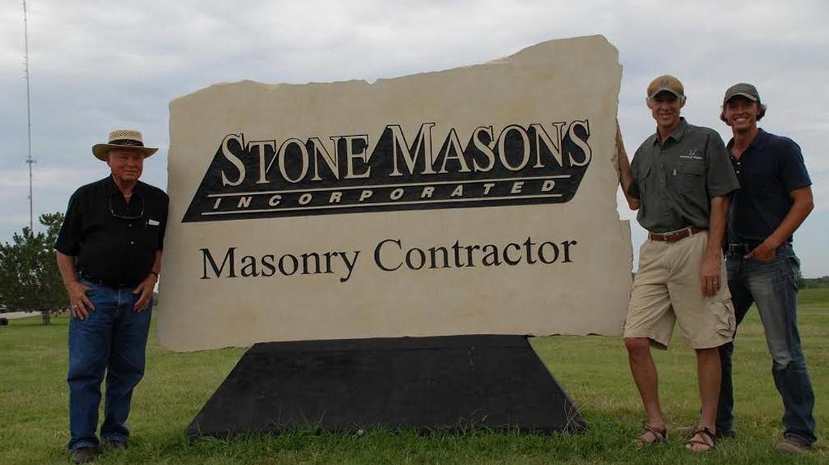 In 2011, Mitchell Born, right, posed next to his father, John Born Jr., and grandfather, John Born Sr., in front of their company sign. Born’s father and grandfather are both deceased, and he’s buying Stone Masons from his mother, Betty.