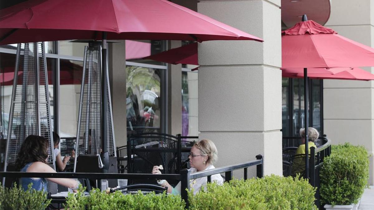 
Diners eat outside of Bella Luna Cafe at Bradley Fair. (May 1, 2013)
