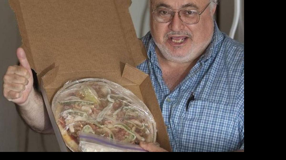 
Jack Fasciano and one of his bake-at-home pizzas.
