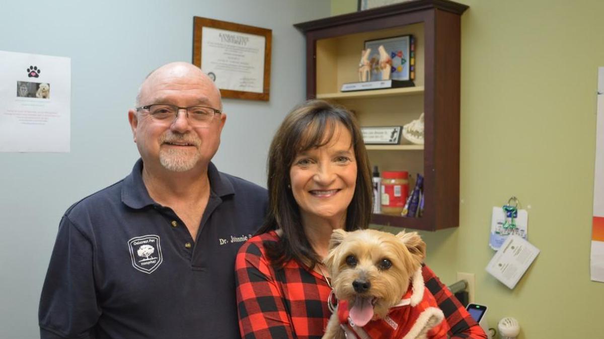 Johnnie and Patti Bruner and their dog, Emma, who brought them together at the Oakcrest Pet Hospital. “That’s how I met her,” Johnnie Bruner says of his wife. “She brought Emma in.” The business is moving just to the west of 119th and Central where it currently is.