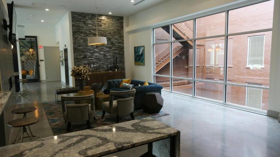Luxury downtown apartment complex lowers rent, changes name