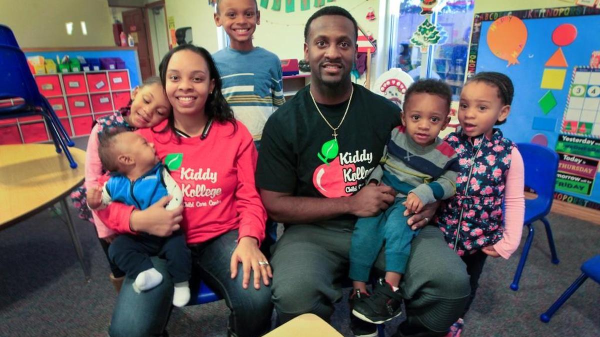Erika and Tony Tomlin pose with their kids, from left to right: Avery, 6 months, Aaliyah, 5, Tre, 7, August, 2, and Ariane , 4, at their child care business, Kiddy Kollege. They will be expanding with two new locations. (Dec. 7, 2017)