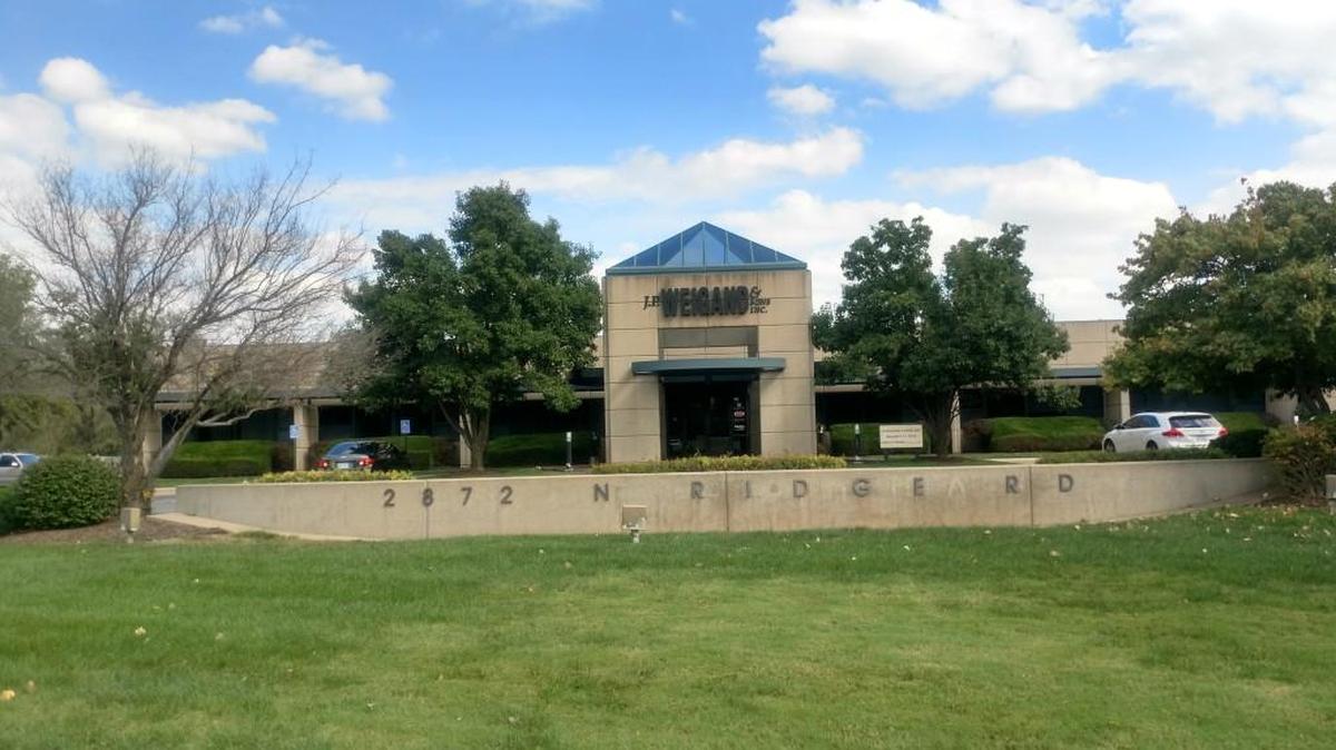 Profit Builders owner Michelle Becker and Bob and Anne Simpson are the new owners of this building at 2872 N. Ridge Road.