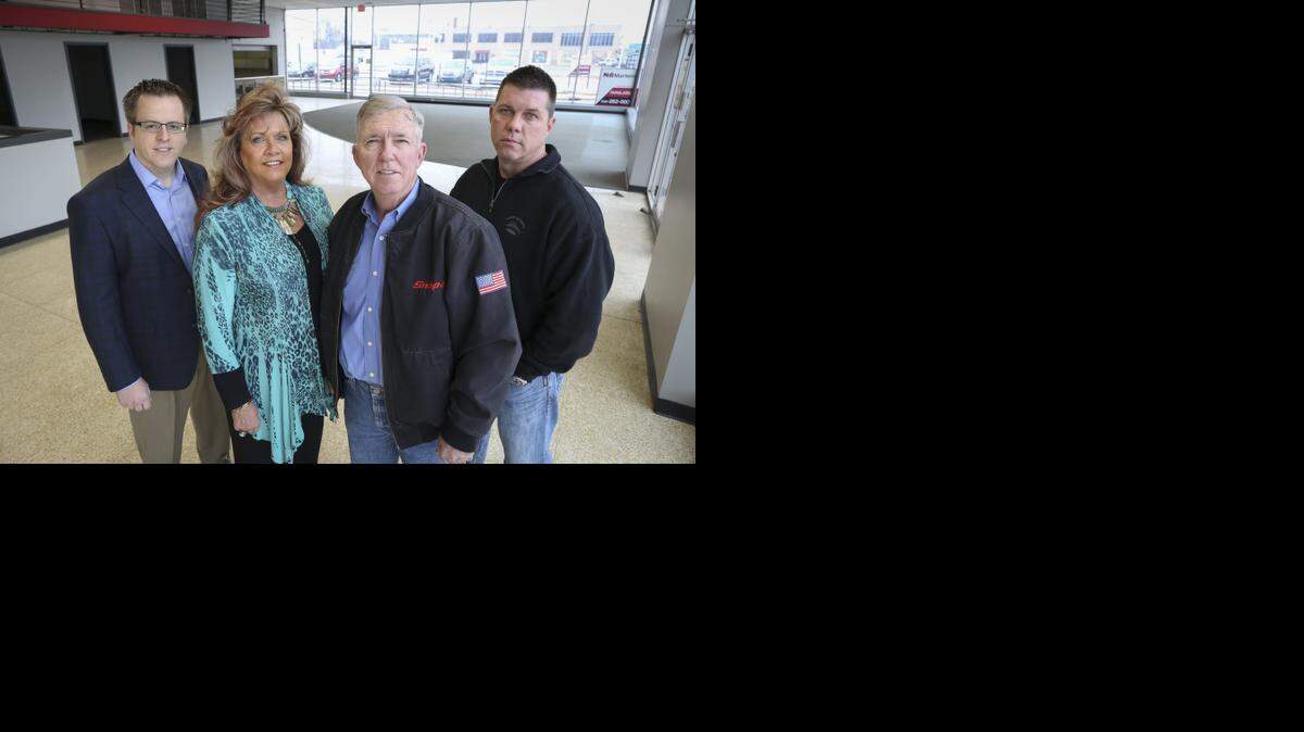
R.D. Wood, second from right, and his wife, B.J., have purchased the former Big Dog Motorcycles showroom at 1520 E. Douglas. The Woods’ son, Zach, right, says its location in the Douglas Design District is ideal. Kris Wessel, left, of NAI Martens represented the Woods family in the deal.
