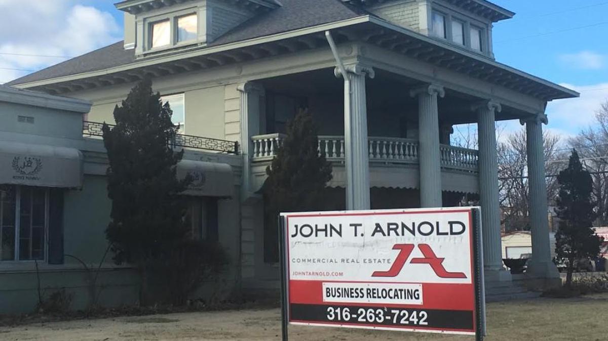 This business relocating sign has been in front of J.R. Koontz Flowers for two years. John T. Arnold Associates still has the building listed for sale, though the store is now closing – not moving.