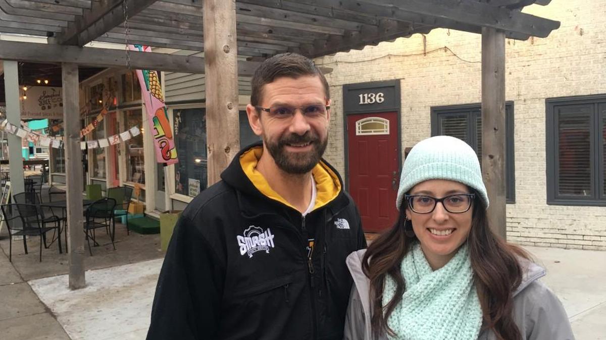 Smash Dev Shop owners Greg Crown and Maggie Schoonover in front of their business’ first office, which is by R Coffee House and Songbird Juice Co. in Riverside.