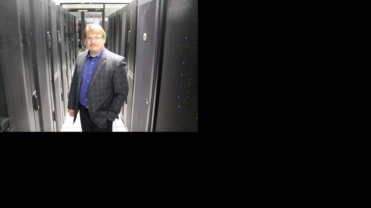 
Dan Reisig stands between server racks in the data center of Concergent, a technology company he leads as president and helped start in 2001.
