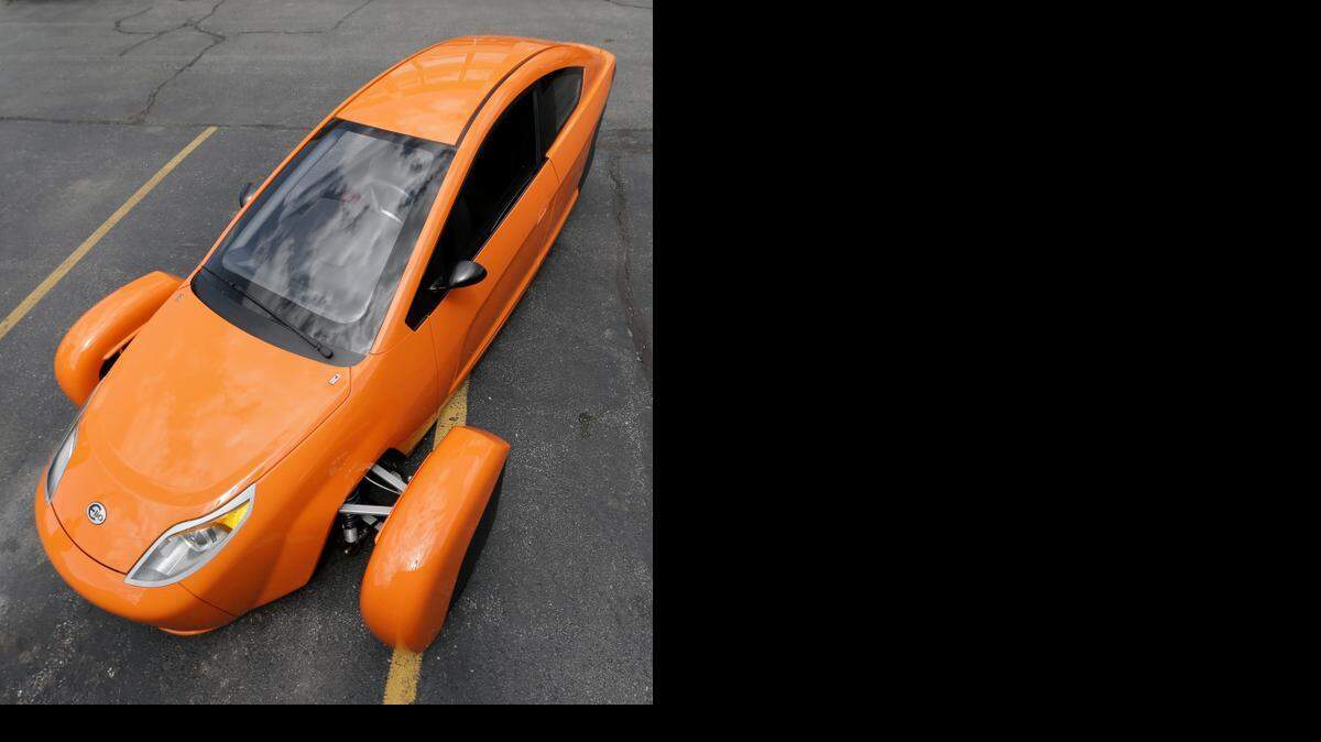 
The Elio, a three-wheeled prototype vehicle, is shown in Royal Oak, Mich., Thursday. The Elio will sell for $6,800 car and can save on gas with fuel economy of 84 mpg.
