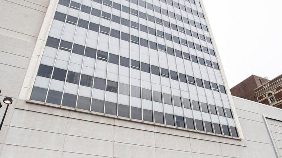 Workers will install on Tuesday a 9-foot-by-106-foot New York Life sign atop the 19-story 125 N. Market building in downtown Wichita.