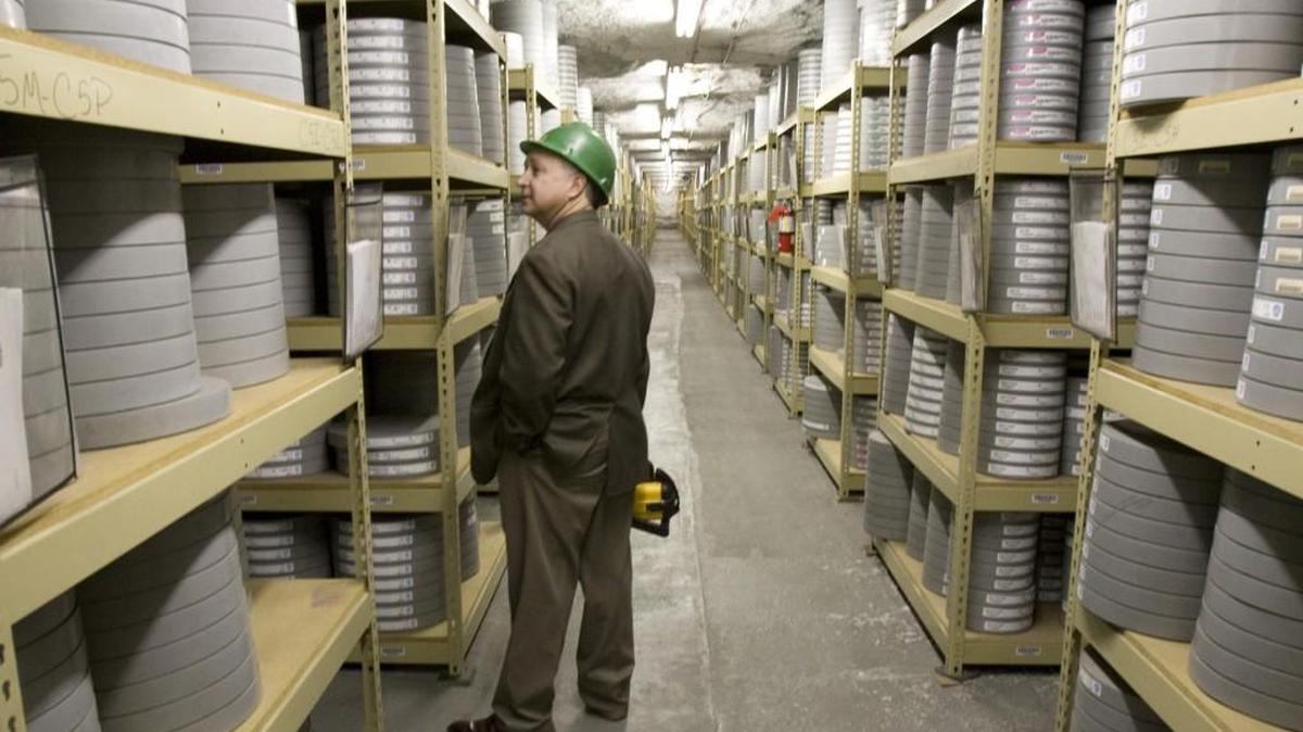 Lee Spence, CEO of Underground Vaults & Storage in the Hutchinson Salt Mines, looks over some of the thousands of movies and television tapes stored there.