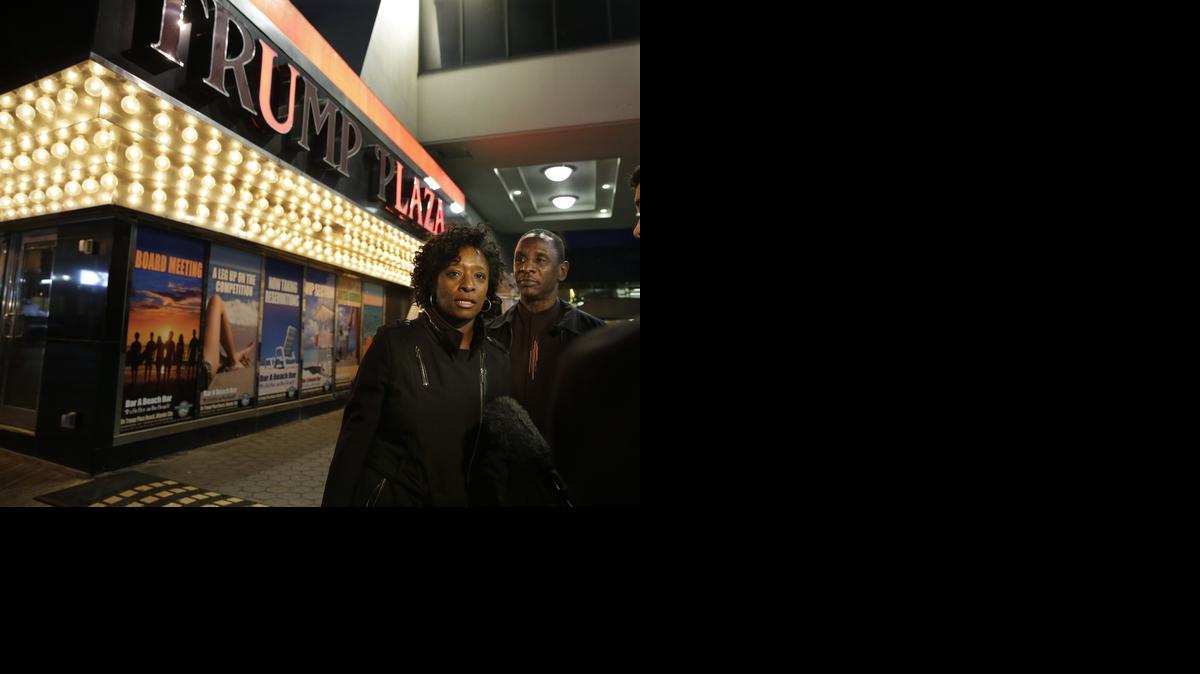 
Ruth Hardrick, a dealer who worked at Trump Plaza Hotel & Casino for 26 years, stands with a friend, Anthony Powell, on the Boardwalk as she answers a question early Tuesday. Trump Plaza is the fourth Atlantic City casino to go belly-up so far this year.

