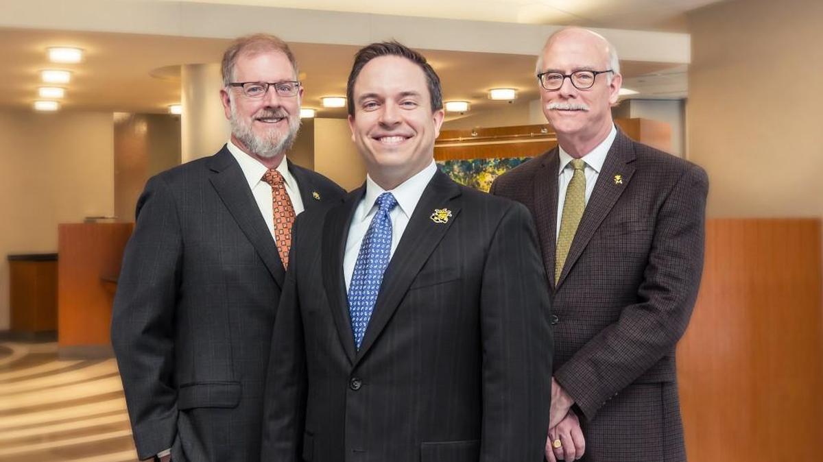 Members of the Bastian family who along with their Fidelity Bank donated $1 million for a new business school building at Wichita State include, from left, Fidelity Bank chairman and CEO Clark Bastian, Fidelity Bank president Aaron Bastian and Fidelity Financial Corp. chairman Clay Bastian.