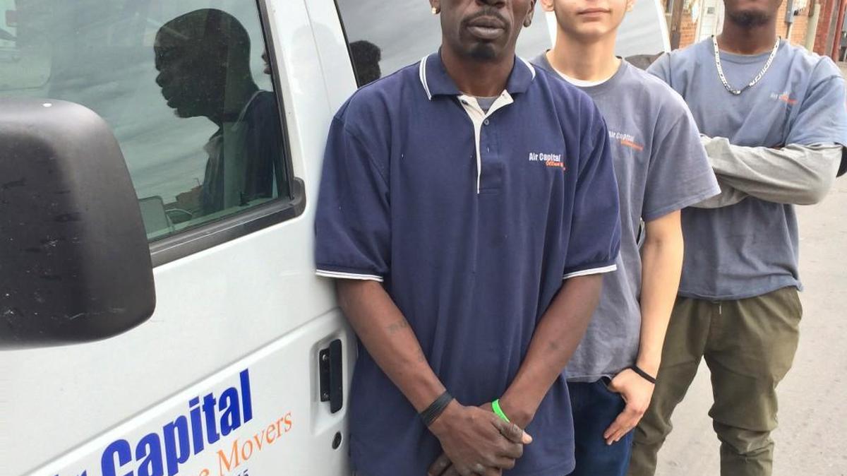 Installation manager Dorian Liggins and installers Zack Ritthaler and Richard Guines say customer service is the top priority at Air Capital Office Movers.