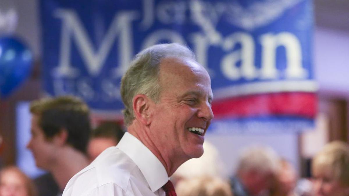 Sen. Jerry Moran shares a laugh with supporters in May while celebrating the opening of his new campaign office in Wichita.