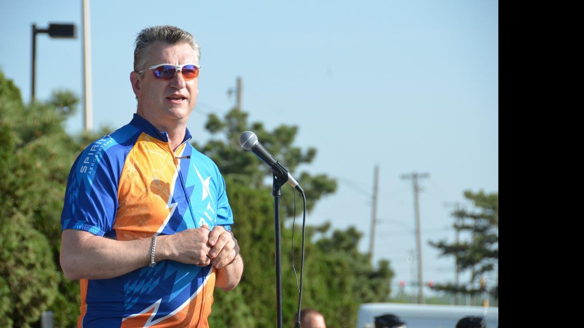 
Spirit AeroSystems CEO Larry Lawson speaks at the American Diabetes Association’s Tour de Cure cycling fundraiser in 2014. For more than a decade, Lawson has ridden in and raised money for Tour de Cure events. 
