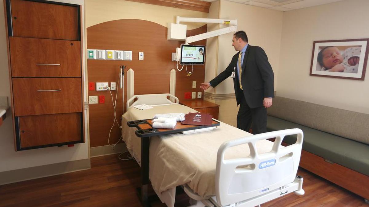 Wesley Medical Center president and CEO Bill Voloch stands in a remodeled birthing room, part of Wesley’s $36 million renovation of Women’s Care Units (Jan. 5 2015)