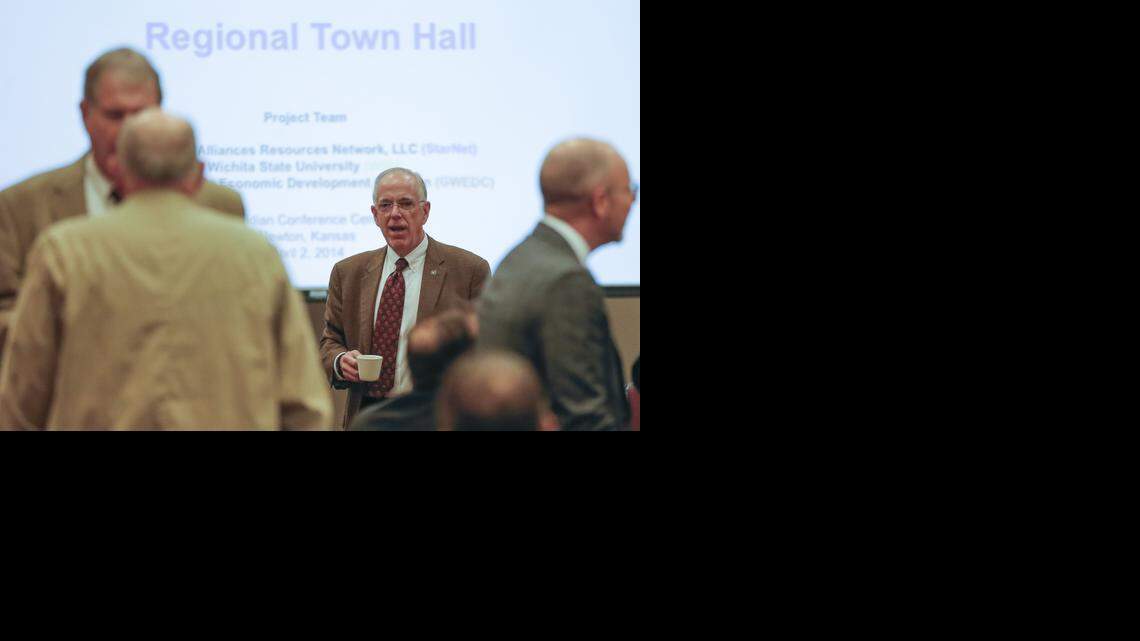 
Charlie Chandler of Intrust Bank visits with other attendees before the start of the Blueprint for Regional Economic Growth public forum in Newton on Thursday morning.
