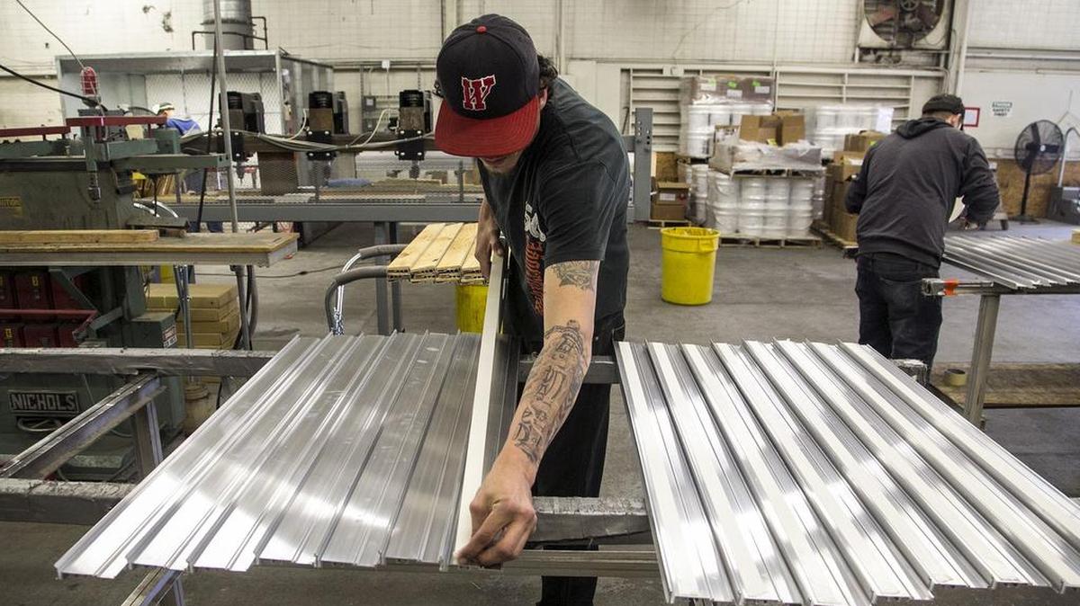 Balco Inc. worker Justin Howell lays adhesive tape on stair nosings at the Wichita plant. The company, which also has a facility in Oklahoma City, was honored with the President’s E Award for Exports in Washington, D.C. The company exports about 25 percent of what it makes overseas. (May 16, 2016)