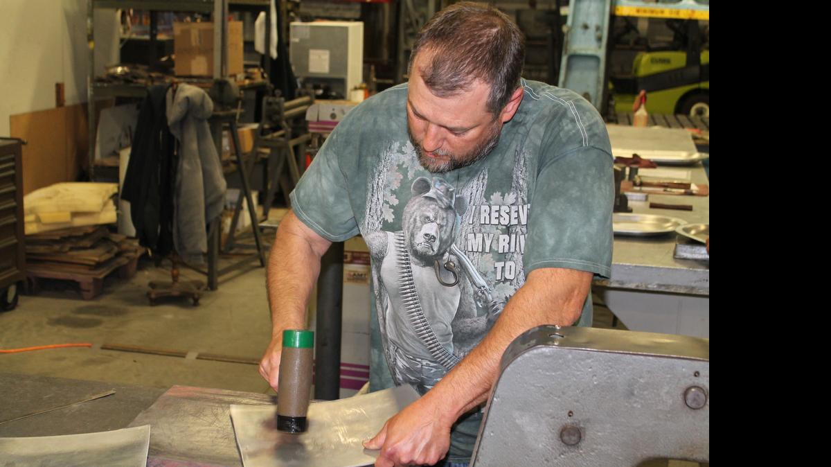 
Dan Claycomb fashions a sheet metal part at Manufacturing Development Inc. in Cheney last week. MDI supplies fabricated sheet metal parts to aircraft suppliers and manufacturers. MDI officials said they are concerned that failure to reauthorize the Export-Import Bank will affect their business and eventually lead to less work.
