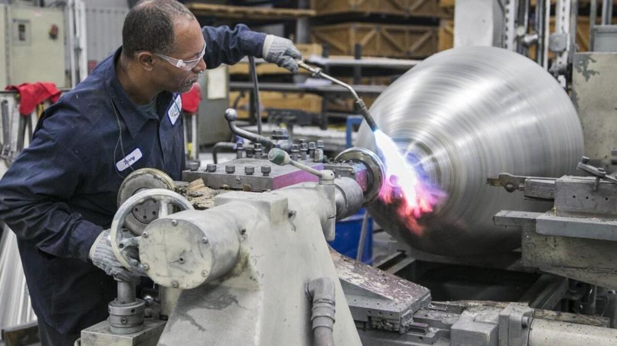 Terry Payne works on a prop spinner for a Lockheed C-130 Hercules at Globe Engineering, an aerospace parts maker in Wichita. (Dec. 1, 2015)