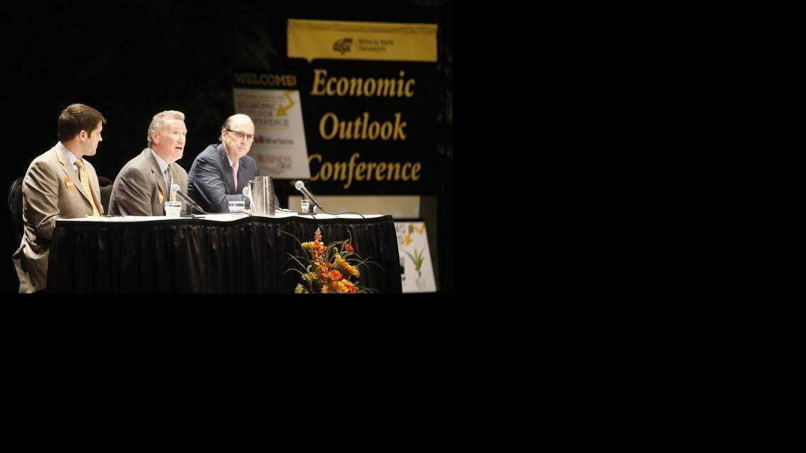 
From left, Jon Rolph of Sasnak, Jerry Jones of Slawson and Jack Kleinhenz, chief economist of the National Retail Federation, answer questions during Wichita State University's Wichita Area Economic Outlook Conference at Century II. (Oct. 9, 2014)
